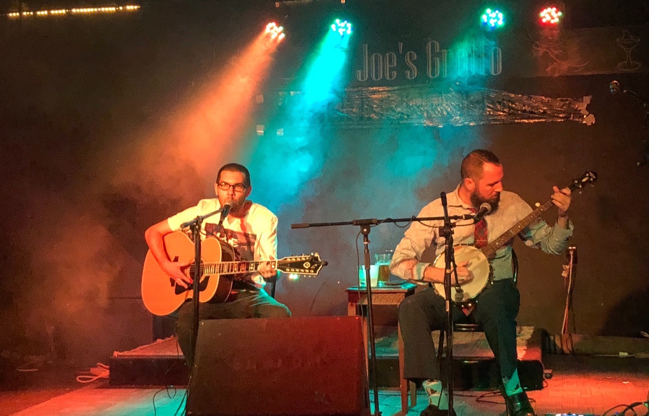 two performers on stage at Joe's Grotto